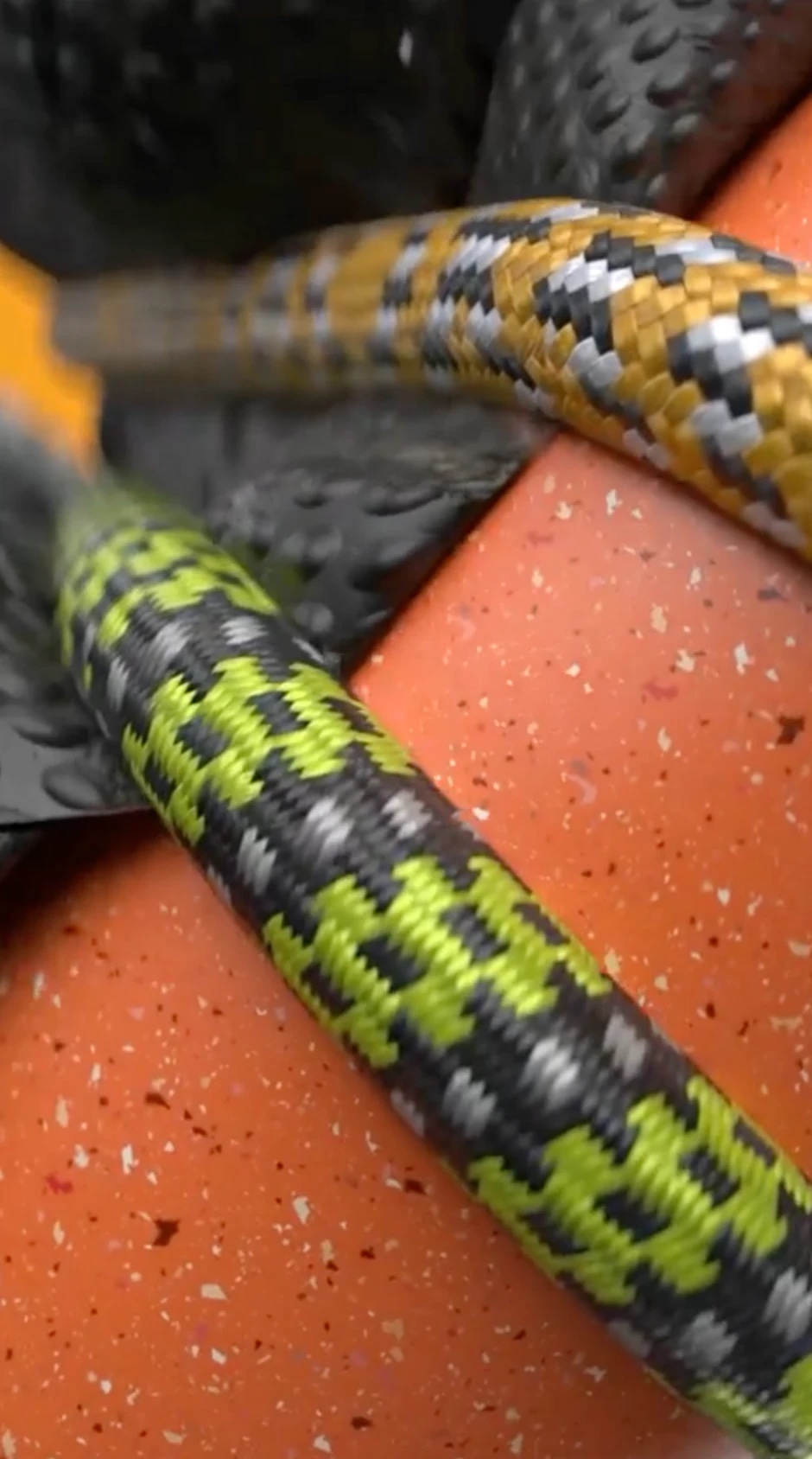 Close-up of braided, colorful rubber bands in a cloth simulation