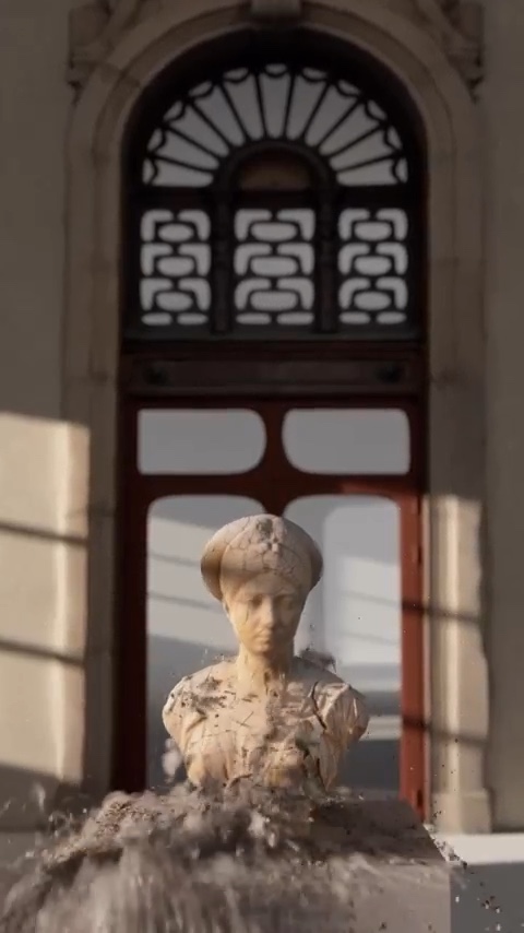 Stone bust on a pedestal in front of an arched window, crumbling from the bottom up into dust and fragments